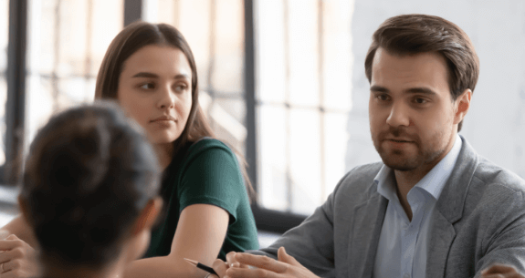 Man talking to coworker
